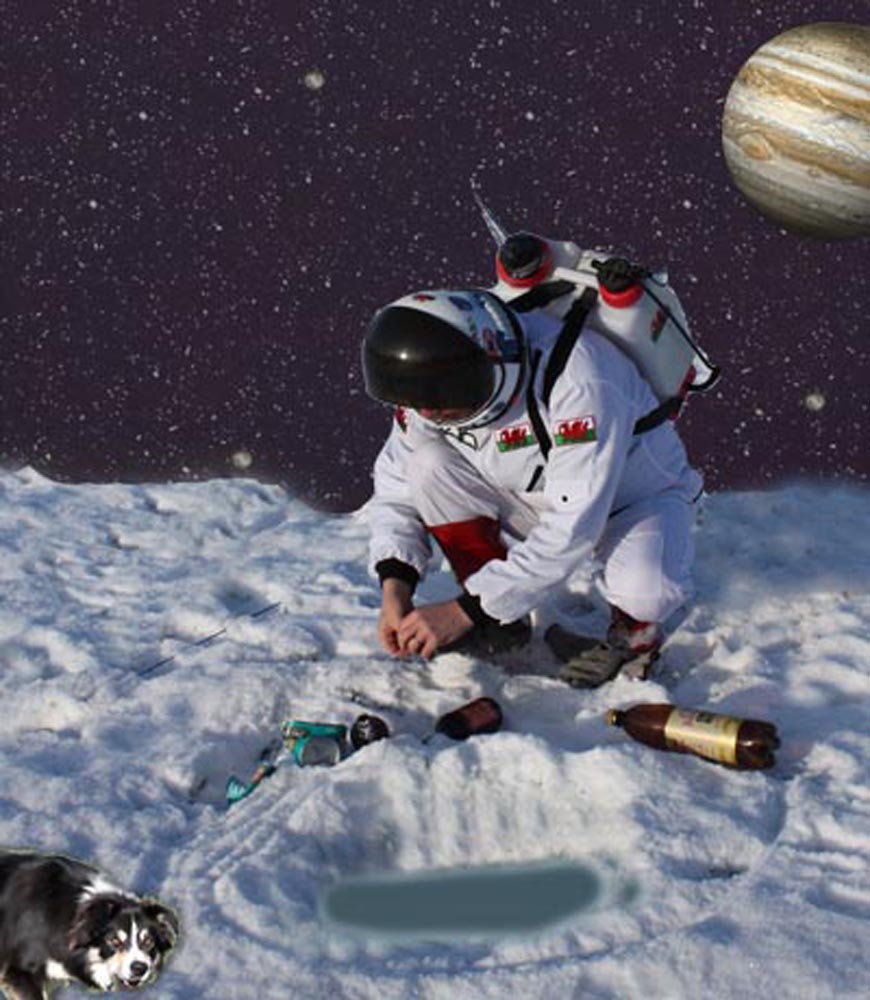 A spaceman kneeling to attend to his fishing rod on a frozen planet surface. Sheep dog in foreground, jupiter in the starry sky behind right