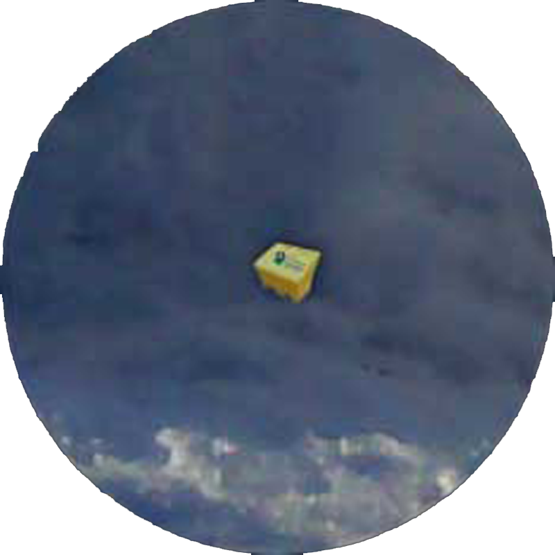 A yellow grit bin from distance in a snow field